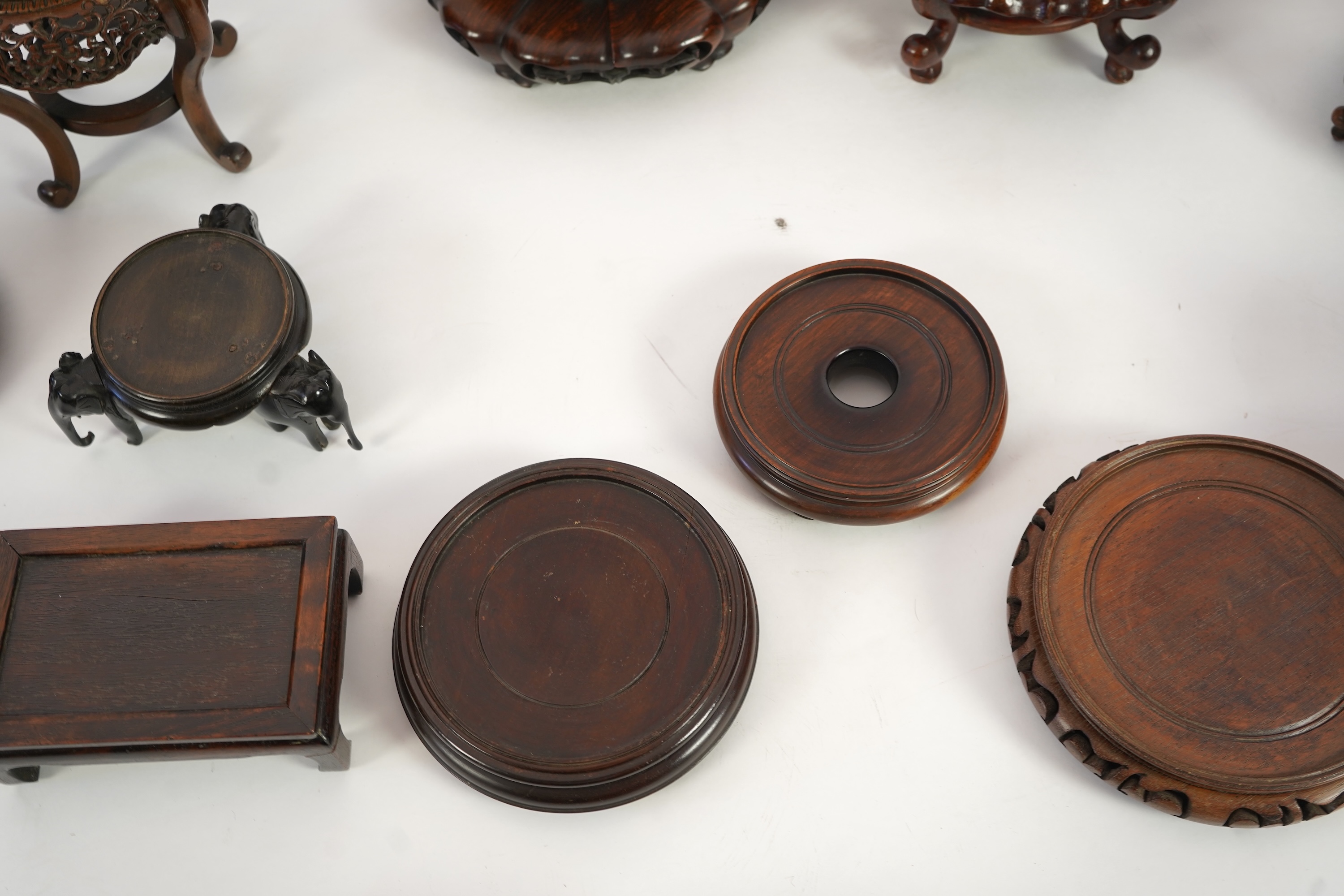 A group of sixteen Chinese hardwood stands together with a Japanese stand, 19th/20th century